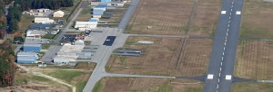 airport aerial with runway and hangars